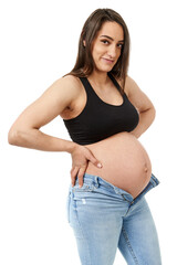 Pregnant woman trying to fit in tight jeans