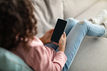 Drone courier flying up with carton package in city