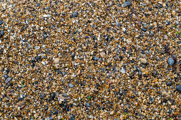 Sea pebbles. Pebble beach. Decorative sea stones. The structure of the stone.