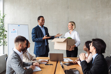 Black Businessman Introducing New Colleague During Business Meeting In Office