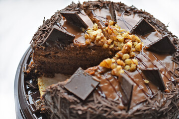 Delicious chocolate cake with nuts and butter
