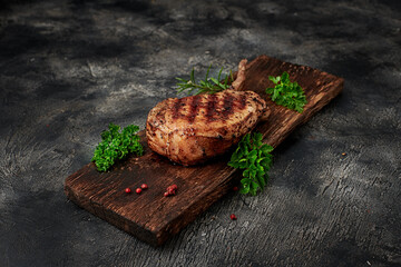 Grilled pork meat with bone on wooden board