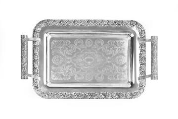 Antique silver tray with handles. Old luxury tray isolated on white background with clipping path. Closeup, top view.
