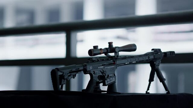 Sniper rifle with telescopic sight mounted on bipod. Rifle with optical sight