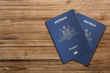 Top view, two Australian passports on a wooden board, the European Union
