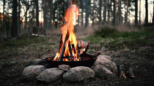Metal kettle on a campfire