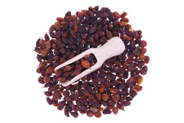 Dried sea buckthorn berries in wooden spoon isolated on white