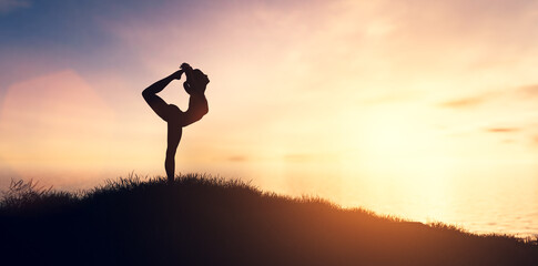 Fototapeta na wymiar Woman in yoga pose, zen meditation at sunset.