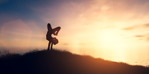 Woman in yoga pose, zen meditation at sunset.