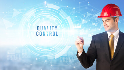 Handsome businessman with helmet drawing