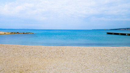 Tropical beach, sea and cloudy sky.