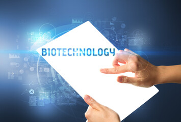 Hand holdig futuristic tablet , technology concept