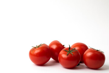Fresh tomatoes on white background