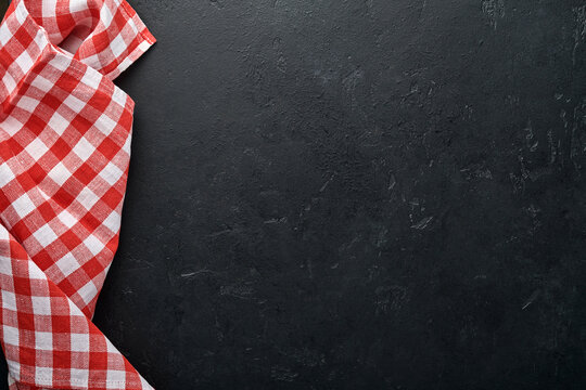 Red Tablecloth On Kitchen Table Black Color With For Your Recipe Or Menu. Top View Flat Lay. Mock Up.