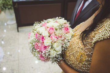 woman holding bouquet of flowers