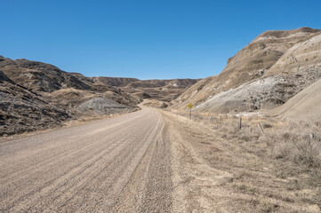 Winding gravel road in the badlands near Dorothy, Alberta, Canada