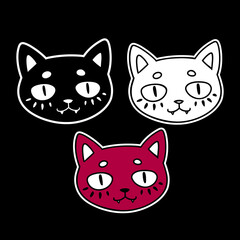 three different colors of cat heads