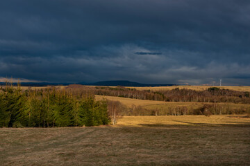 Sunset near Spicak hill in Krusne mountains in north Bohemia in winter day