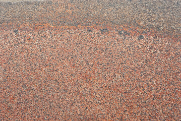 Texture of red, black and white marble. Stone tile with natural pattern. Marble pavement closeup.