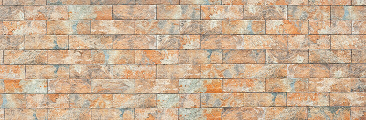 Plaster on a yellow wall. Concrete wall texture close up.