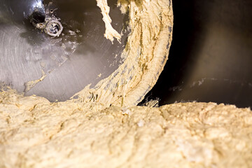 Kneading dough at the bakery. Manufacture of bread.