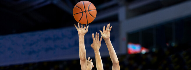 Professional basketball players in action. Sports background for app, banner, or mockup
