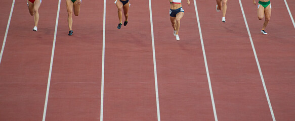 Running woman sprinters runners in 100 meters. Professional sport concept