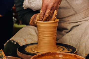 hands of a potter at work