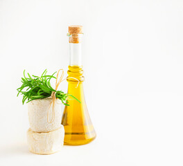 Olive oil on bottle with fresh rosemary twig and brie camambert cheese, isolated on white...
