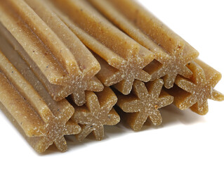 Dog dental sticks for cleaning teeth isolated on white background, close up