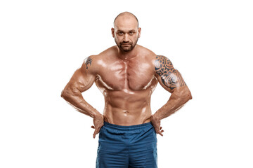 Fototapeta na wymiar Tattooed male bodybuilder posing over white background. Fitness workout concept, muscle groups, watch your body.