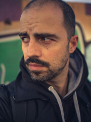 Fototapeta premium Portrait of a man with beard graffiti background