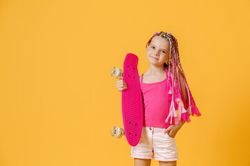 Active young girl with dreadlocks in pink shirt and shorts with