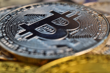 Top view of silver and golden cryptocurrency bitcoin coins.