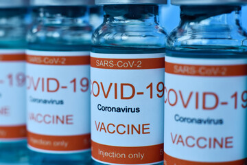 Row ampoules with Covid-19 vaccine.