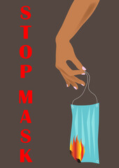 Red color lettering Stop mask. Hand holds burning protective medical surgical mask. Destroy respirators. End of the coronavirus pandemic. End of mask mode.