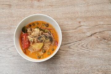 boiled duck with herb in coconut milk curry Thai spicy soup on bowl