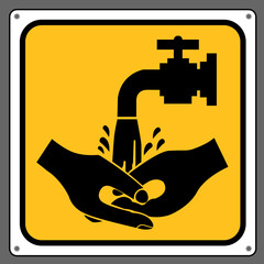 The faucet washes hands from dirt.,Caution sign