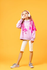 Adorable child in rounded glasses with pink dreadlocks listen to