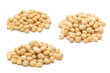 Macadamia nuts isolated on white background.