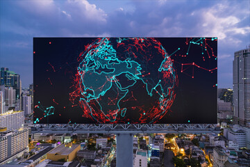 Hologram of Earth planet map on billboard over night panoramic cityscape of Bangkok. The concept of international companies in Southeast Asia.