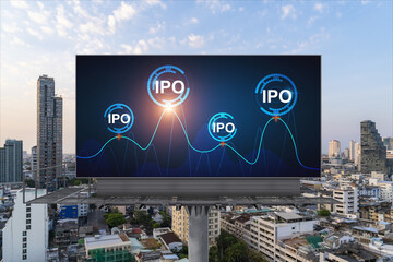 IPO icon hologram on road billboard over sunset panorama city view of Bangkok. The hub of initial...