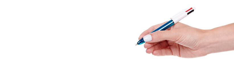 Hand with glossy ballpoint pen, isolated on white background.