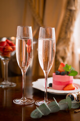 Two glasses of sparkling wine or champagne and strawberries in the theater buffet, intermission at the performance