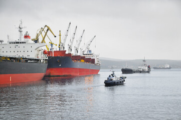 Naklejka premium Ships in the Kola Bay near Murmansk. The port city of Murmansk is located on the shores of the Kola Bay, on the Kola Peninsula (beyond the Arctic Circle)
