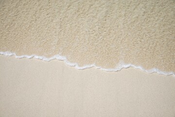 abstract sand of beach and soft wave background : close up