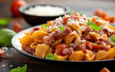 Conchiglie alla Amatriciana pasta with pancetta bacon, tomatoes and pecorino cheese. Healthy Italian food