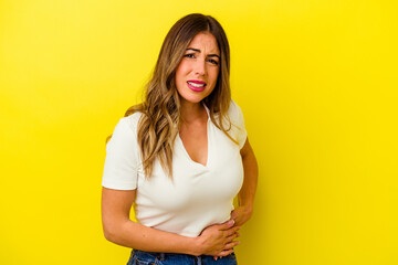 Young caucasian woman isolated on yellow background