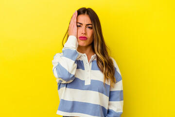 Young caucasian woman isolated on yellow background