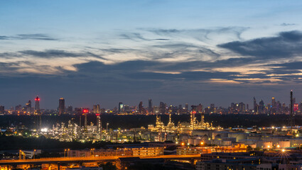 Oil refinery plant industry zone, Aerial view oil and gas petrochemical Refinery factory oil storage tank and pipeline steel at , Ecosystem and Safety  Twilight sky Evening City Backdrop